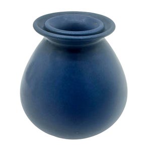 May include: A matte navy blue ceramic vase with a rounded, bulbous body and a wide, flared rim. The vessel features a smooth, solid-colored surface with a consistent dark blue finish throughout its exterior, showcasing a simple, functional form.