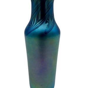 May include: A blue iridescent glass vase with a wavy pattern. The vase has a narrow neck and a wide base.