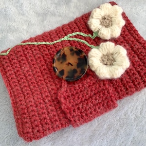 Red wool paperback book cover with flowers