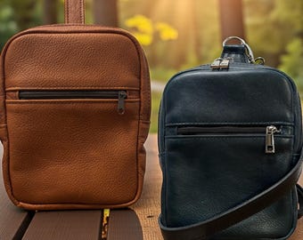 Bolso bandolera de cuero con acceso rápido y tirador para transporte oculto.