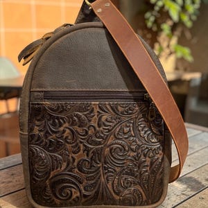 Leather concealed carry quick access pull tab slingbag or side access option.