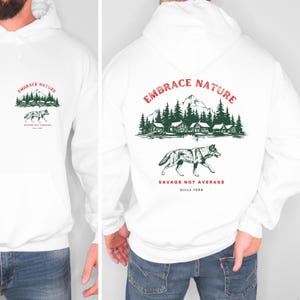 Gemütliches Sweatshirt mit Wolfsmotiv, Outdoor-Bekleidung mit Wolfsprint, von der Natur inspirierter Hoodie, Geschenk für Naturliebhaber, Outdoor-Sportbekleidung. Bild 2