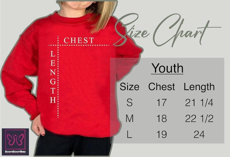 a woman wearing a red shirt with a height chart on it