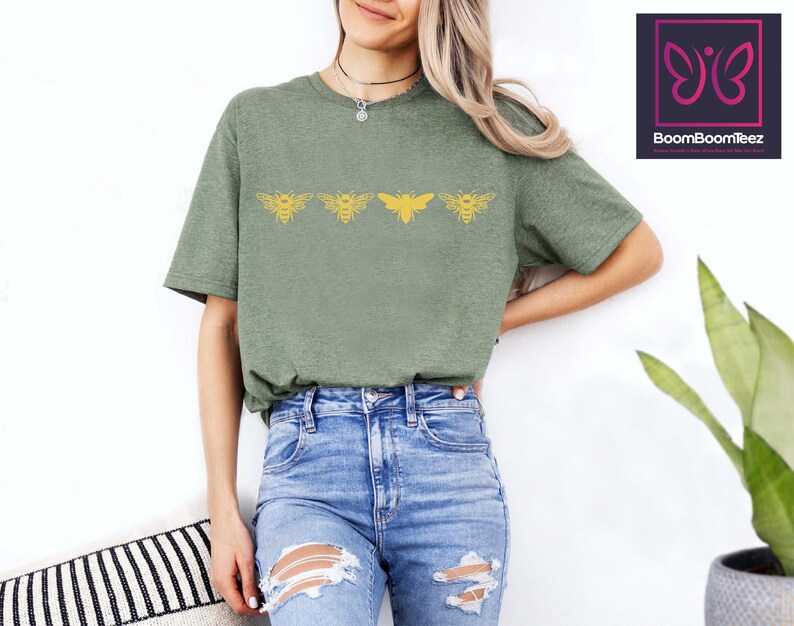 a woman wearing a green shirt and ripped jeans