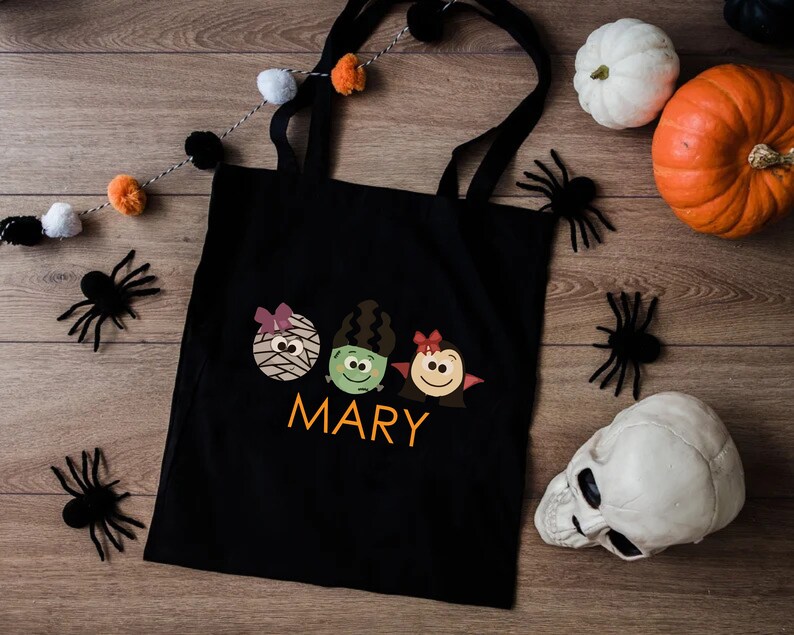 a trick or treat bag sitting on top of a wooden floor