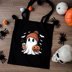 a black bag with a ghost and a pumpkin on it