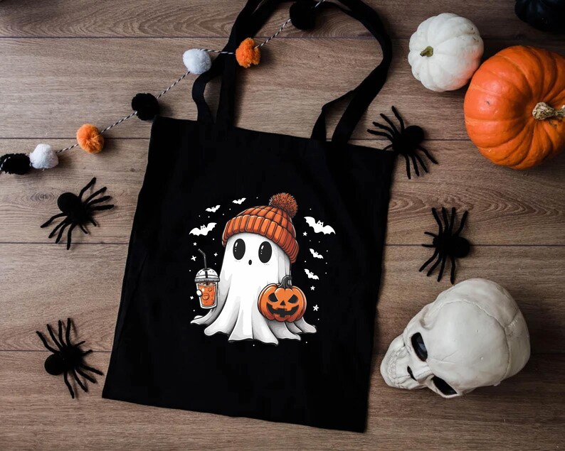 a black bag with a ghost and a pumpkin on it