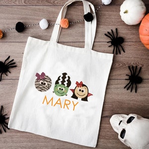 a trick or treat bag sitting on top of a wooden floor