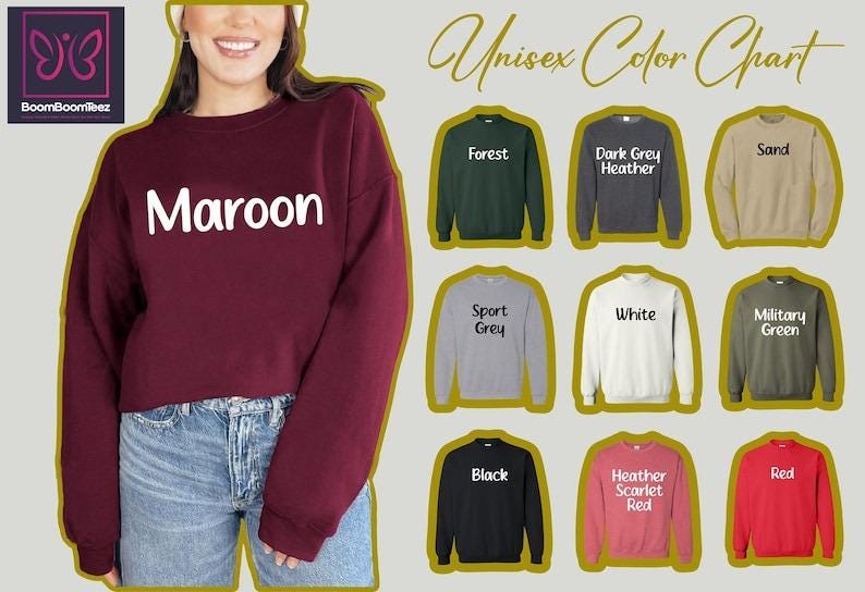 a woman wearing a maroon and black sweatshirt with the word maroon on it