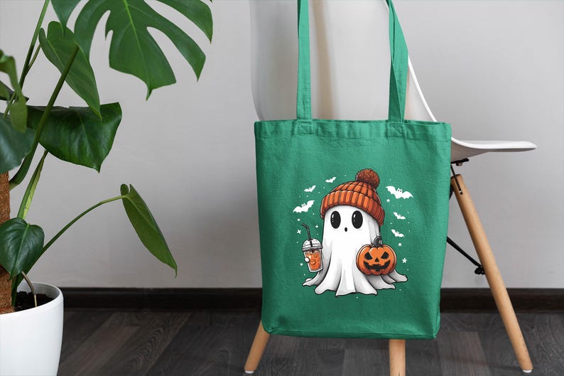 a green bag with a ghost holding a pumpkin