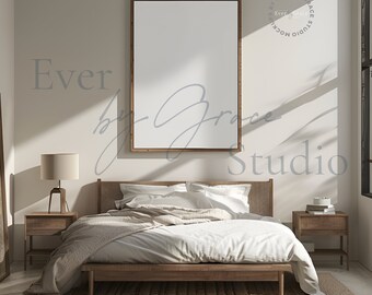 May include: A bedroom interior with a wooden bed frame, white bedding, and a brown throw blanket. A framed picture hangs on the wall above the bed. There are two wooden nightstands with lamps on either side of the bed. A brown rug is on the floor.