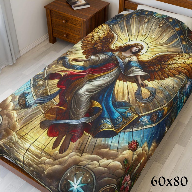 May include: A decorative throw blanket featuring a stained-glass style angel design. The angel is depicted with golden wings, a halo, and flowing robes in shades of blue, red, and white. The blanket measures 60x80 inches.