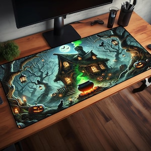 May include: A black and green Halloween themed mousepad with a spooky house, trees, and a cauldron with green smoke. The house has a lit window and a moon is visible in the sky.