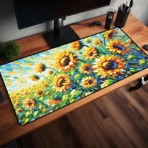 May include: A rectangular desk mat featuring a vibrant painting of sunflowers. The artwork showcases yellow, orange, and blue hues, with a textured, impressionistic style. The mat has a black border and is designed for use with a computer setup.