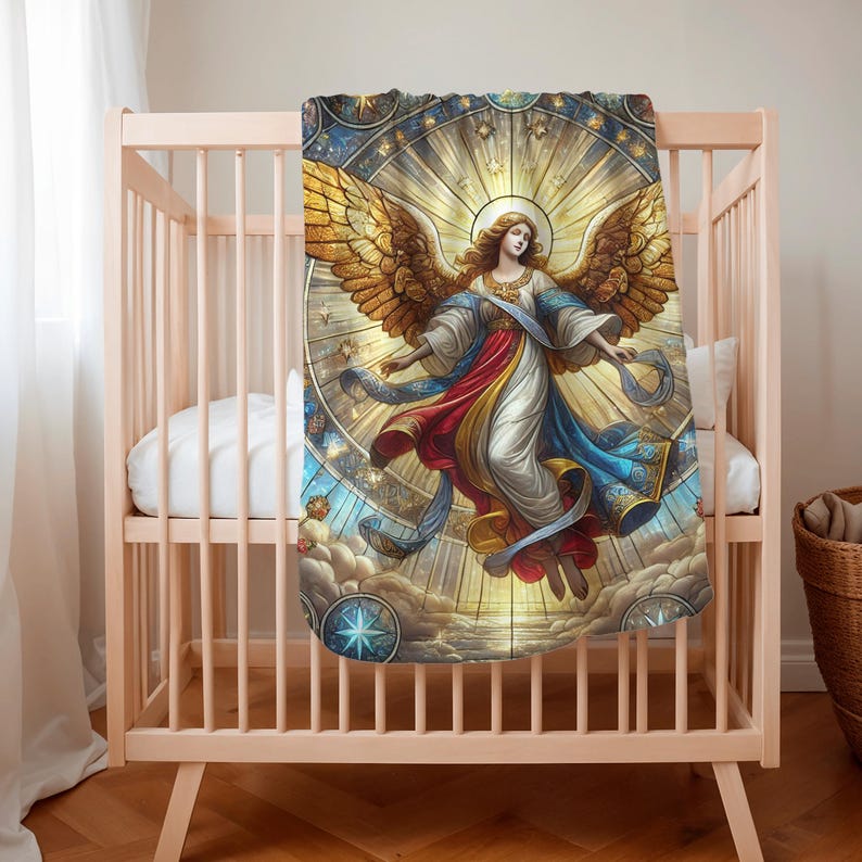 May include: A baby blanket featuring a detailed illustration of an angel with golden wings, flowing robes in red, white, and blue, and a halo. The design is set against a stained-glass style background with celestial elements.