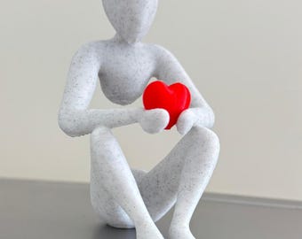 Minimalist Heart-Holding Figurine Sculpture