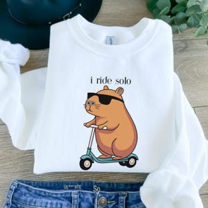 Riding Solo Hoodie Capybara Clothing Capybara Gifts For Animal Lover Capybara Themed Gift Capybara Apparel Capybara Crewneck Sweatshirt