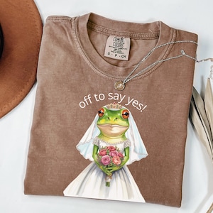 May include: A set of three ceramic mugs with a speckled, matte finish. The mugs are in shades of cream, light brown, and dark brown. Each mug has a simple, minimalist design, perfect for coffee or tea.