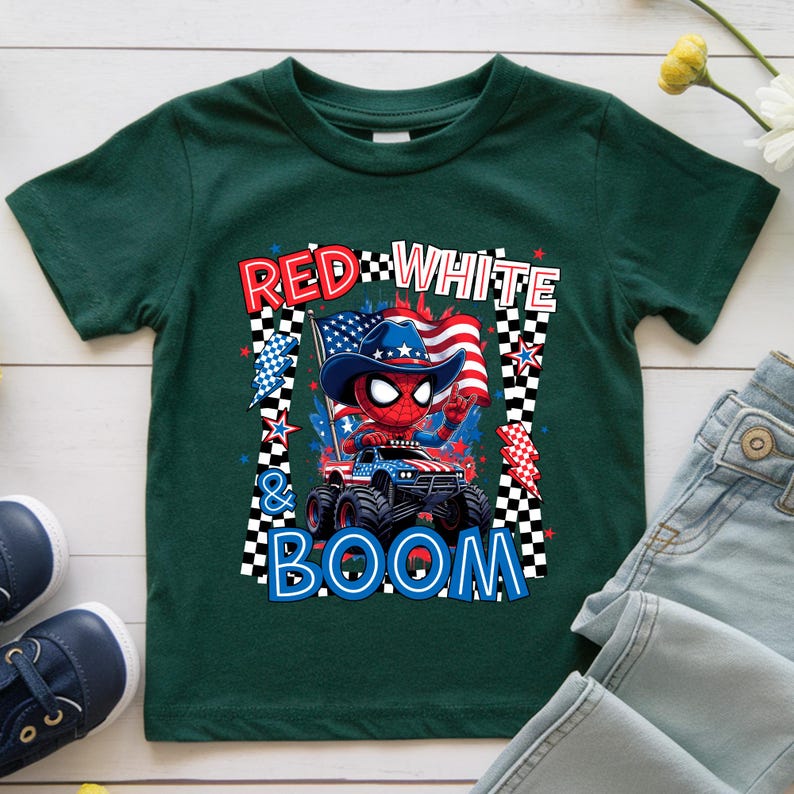 May include: Green toddler t-shirt featuring a graphic of Spider-Man in a cowboy hat driving a monster truck with an American flag. The text "RED WHITE & BOOM" is displayed in red, white, and blue.