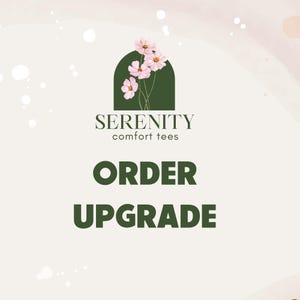 May include: A graphic with the text "SERENITY comfort tees" and "ORDER UPGRADE" in dark green. The top of the graphic features a dark green arch with pink flowers. The background has a watercolor effect with light pink and white.