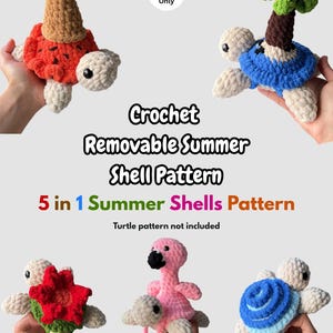 May include: A crochet pattern titled Crochet Removable Summer Shell Pattern 5 in 1 Summer Shells Pattern, featuring five plush turtle shells: an ice cream cone, a palm tree, a red flower, a pink flamingo, and a blue spiral shell.