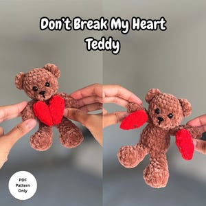 May include: A brown teddy bear with a red heart, held up against a gray background. The text "Don't Break My Heart Teddy" is above the bear. The bear is made of a soft, plush material.