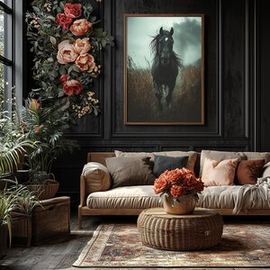 A powerful black horse gallops through a rain-soaked field, its mane flowing wildly, with a stormy sky and dark clouds in the background, captured in dramatic detail on a framed gallery canvas.