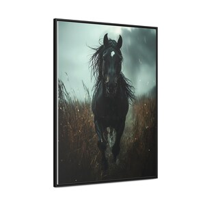 A powerful black horse gallops through a rain-soaked field, its mane flowing wildly, with a stormy sky and dark clouds in the background, captured in dramatic detail on a framed gallery canvas.