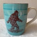 Sasquatch Turquoise Blue and Cream Colored Ceramic Coffee Cup