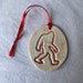 Ceramic antique red Big Foot Sasquatch round flat ornament