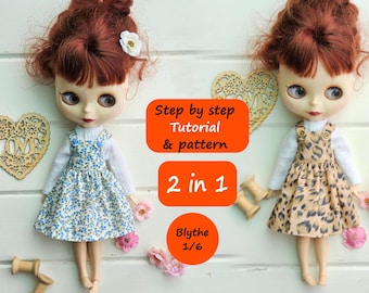 May include: Two Blythe dolls wearing different dresses. The doll on the left is wearing a blue and white floral dress with a white long-sleeved shirt. The doll on the right is wearing a brown and black animal print dress with a white long-sleeved shirt. The dolls are standing on a white wooden surface. The text "Step by step Tutorial & pattern 2 in 1 Blythe 1/6" is written on the image.