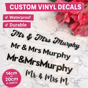 May include: Custom vinyl decals with the text "Mr & Mrs Murphy" in various styles. The decals are waterproof and durable, available in 14cm or 20cm lengths. The image also includes the text "Custom Vinyl Decals".