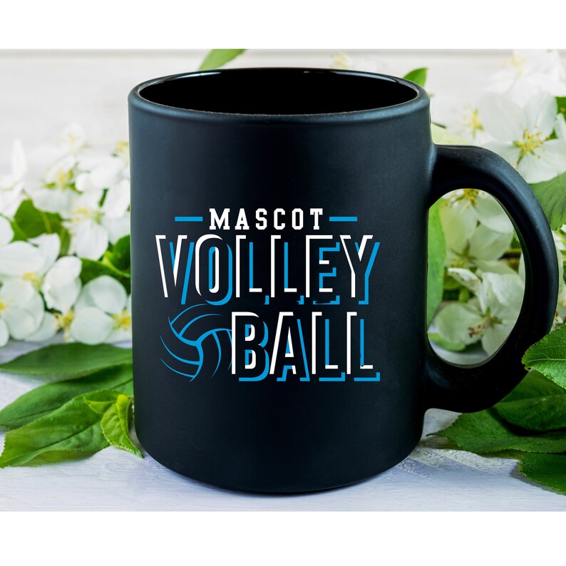 May include: Black ceramic coffee mug with a white graphic that says "MASCOT VOLLEYBALL" with a blue volleyball graphic.