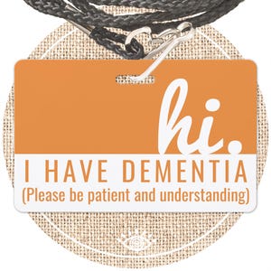 May include: Orange lanyard with a plastic ID card that says "hi. I HAVE DEMENTIA (Please be patient and understanding)"
