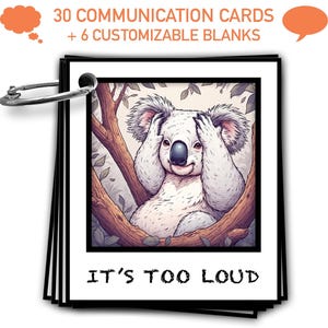 May include: A set of communication cards held together by a silver ring. Each card has a black border and features a cartoon koala bear covering its ears. The text "IT'S TOO LOUD" is printed at the bottom of the card.