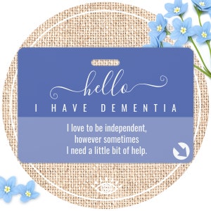 May include: A blue and purple laminated card with a white border and rounded corners. The card has a hole in the top for a lanyard. The text on the card reads "hello I HAVE DEMENTIA I love to be independent, however sometimes I need a little bit of help."