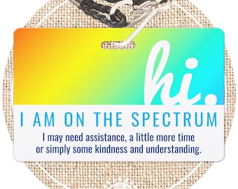 May include: A colorful lanyard with a plastic badge that reads "hi. I AM ON THE SPECTRUM I may need assistance, a little more time or simply some kindness and understanding."