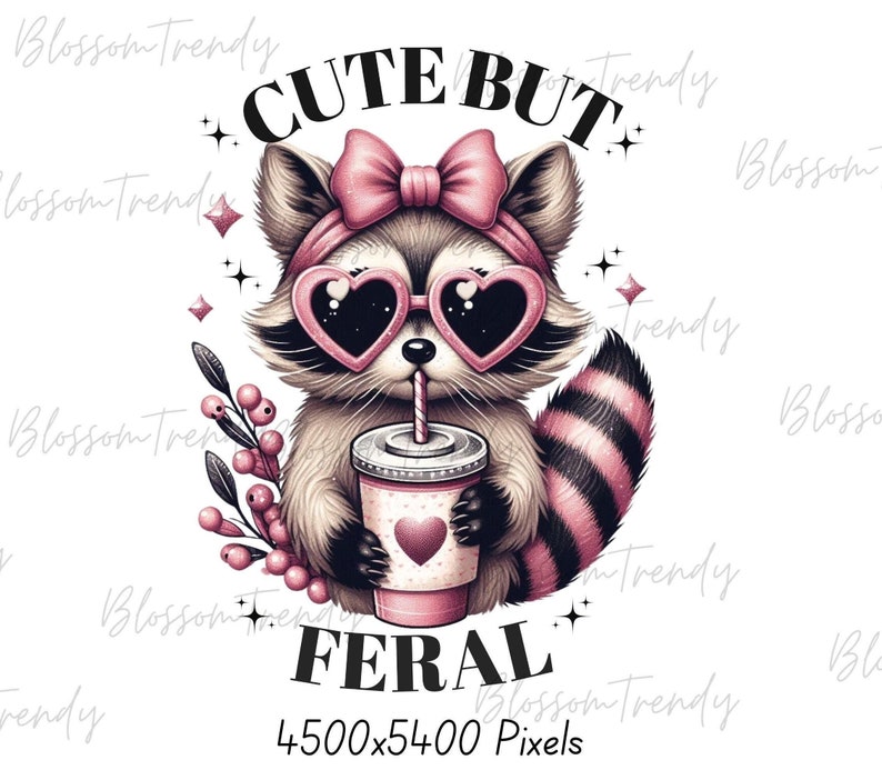 May include: Cute but feral graphic featuring a cartoon raccoon wearing pink sunglasses and a pink bow. The raccoon is holding a pink and white cup with a straw and a pink heart design. The text "Cute but Feral" is written below the raccoon.