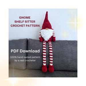 May include: A crochet gnome shelf sitter with a tall red hat, a white textured beard, and long red and white striped legs with red feet. The text reads: GNOME SHELF SITTER CROCHET PATTERN, PDF Download, 100% hand-tested pattern by a real crocheter.