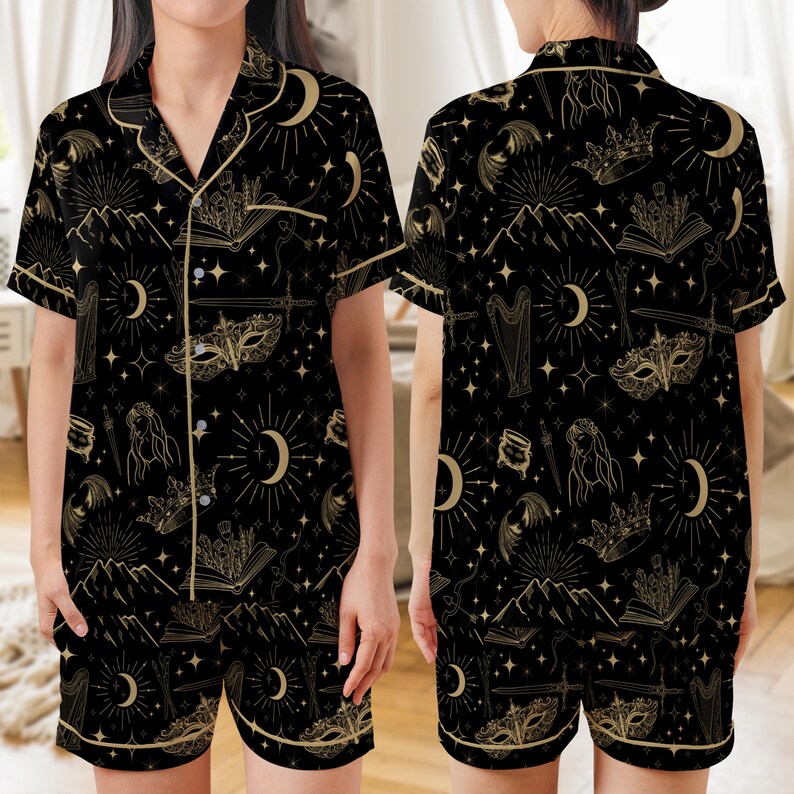 Black celestial satin pajama set for romantasy fans, featuring a fantasy-inspired print, short sleeve top and shorts