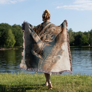 Cozy woven dragon tapestry blanket ideal for fantasy reading nook or gamer gift setup. dragon woven blanket for fantasy lover fans of fourth wing book lover gift castlecore dragon blanket dragon rider books