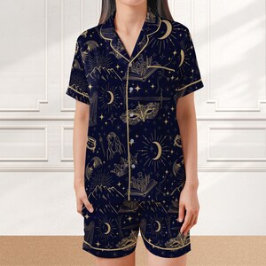 Navy blue summer pajama set for women with a whimsical book lover design, celestial fantasy print on soft satin fabric