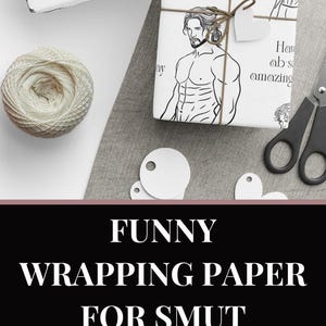 May include: White wrapping paper featuring a black line drawing of a muscular man. The paper is used to wrap gifts and is tied with twine. Text on the paper reads "Have an absolutely amazing birthday."