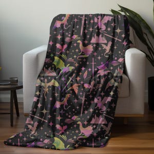 fantasy black and multicolored blanket with dragons, castles, swords and stars for book lover fans of fantasy and gamers