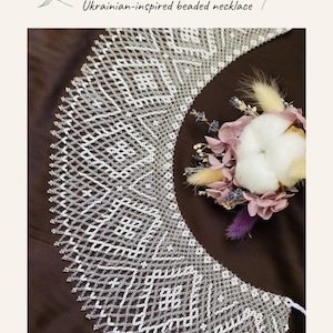 May include: A white beaded necklace with a geometric pattern, featuring the text SILYANKA BEADING PATTERN, Ukrainian-inspired beaded necklace, Kristen Style, and PDF DIGITAL DOWNLOAD. The necklace is displayed alongside a small floral arrangement.