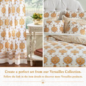 May include: White bedding with a yellow and gray paisley pattern. The bedding is shown on a bed with pillows and a headboard. The bedding is also shown as curtains in a room with a side table and books.
