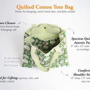 May include: A green and white floral quilted cotton tote bag with striped handles and interior lining. It features a magnetic button closure, a 9-inch by 12-inch interior pocket, and 12-inch drop straps. Dimensions are 18.5 inches H by 15 inches L by 6 inches W.