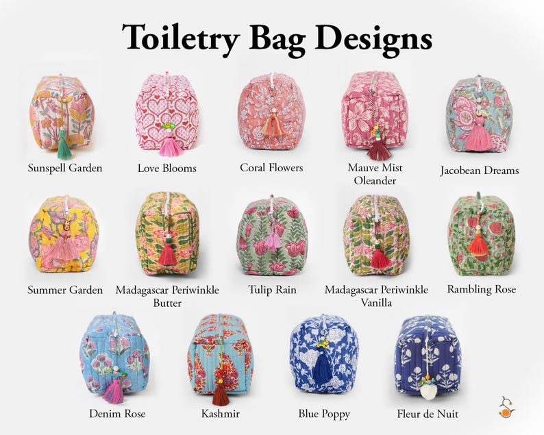 May include: A collection of fourteen rectangular toiletry bags with quilted fabric, each featuring a unique floral or heart pattern and a decorative tassel on the zipper pull. The bags are arranged in three rows with labels including Sunspell Garden, Love Blooms, Coral Flowers, Mauve Mist Oleander, Jacobean Dreams, Summer Garden, Madagascar Periwinkle Butter, Tulip Rain, Madagascar Periwinkle Vanilla, Rambling Rose, Denim Rose, Kashmir, Blue Poppy, and Fleur de Nuit.
