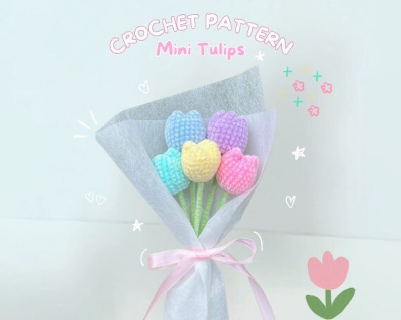 May include: A bouquet of five crocheted mini tulips in pastel colors, wrapped in white tissue paper with a pink ribbon. The bouquet is tied with a pink ribbon and has a handwritten label that says "CROCHET PATTERN Mini Tulips".