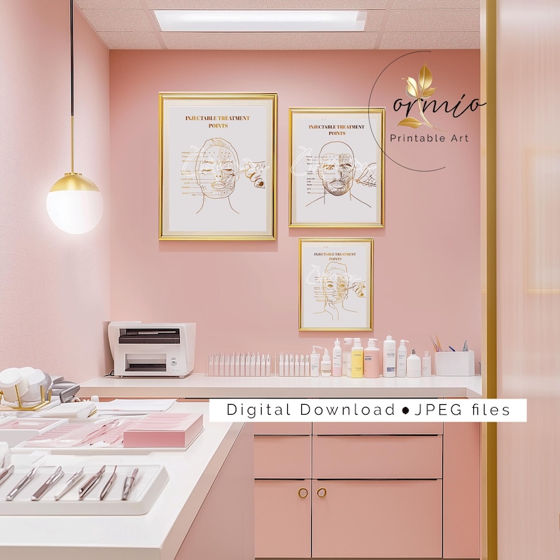 May include: Three gold framed illustrations of the human face with labeled points for injectable treatment. The illustrations are on a pink wall in a room with a white countertop and cabinets. The text on the illustrations reads "Injectable Treatment Points".